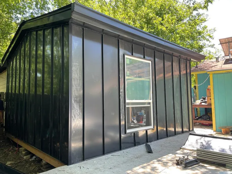 Black standing seam metal wall panels for Roof Inspection in St. Thomas