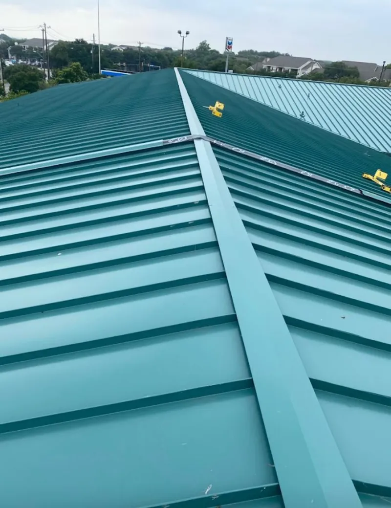 Green commercial metal roof ridge and valley for Metal Roof Repair in St. Thomas