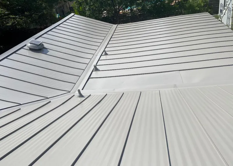 Solar attic fan installed on a metal roof for Roof Ventilation in St. Thomas